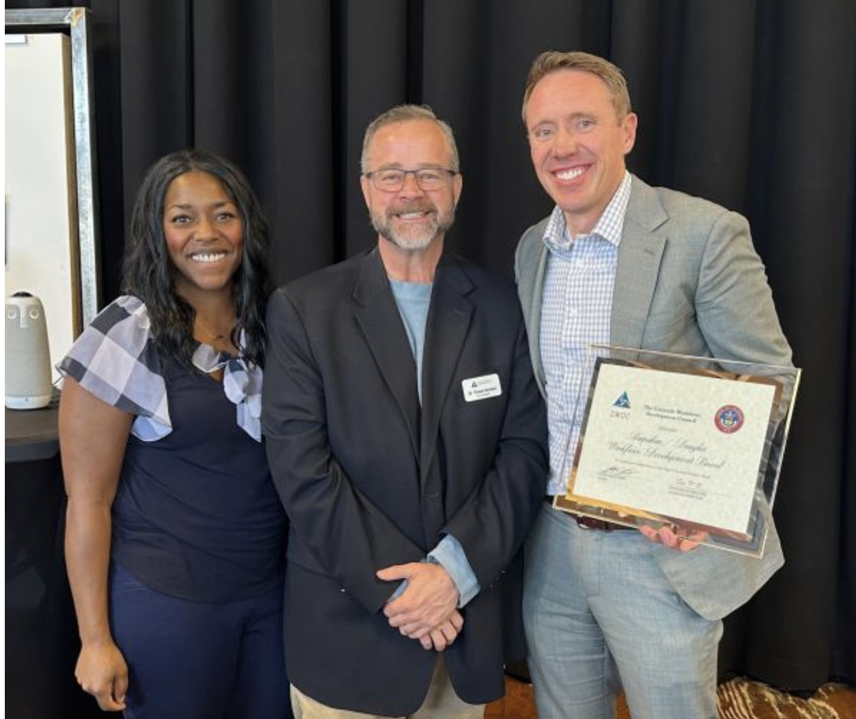 Photo of A/D Works board members accepting High Performing Board Designation