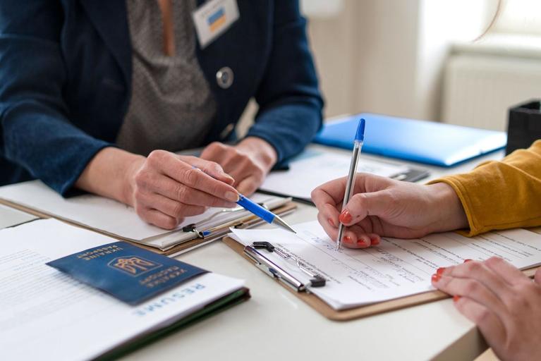 Woman filling out paperwork