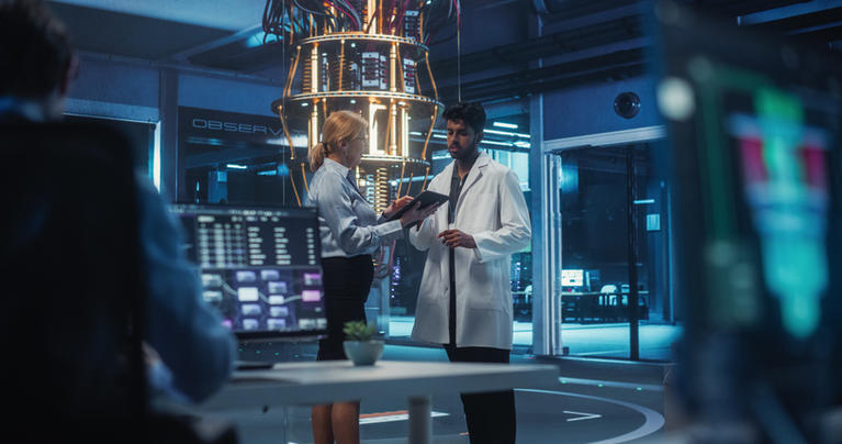 Business partner collaborating with quantum scientist