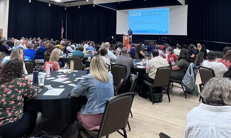 Photo of speaker and audience in attendance at the 2025 PWR Regional Training in the Pikes Peak Region.