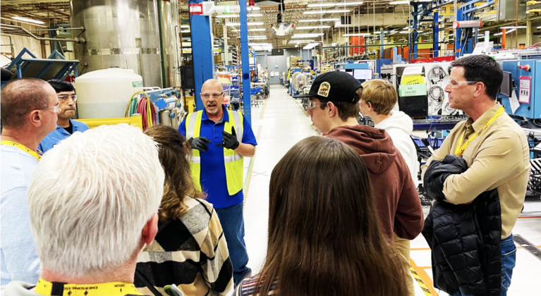 Group of students speak with Boulder Manufacturer about Work-based learning opportunities.