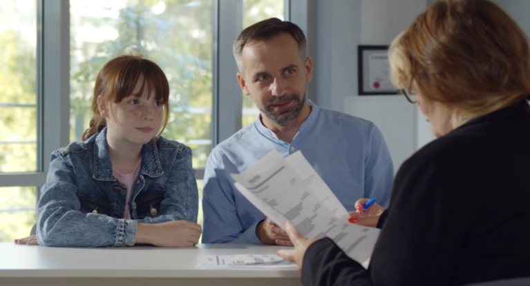 Student and parent meet with teacher to discuss options for work-based learning