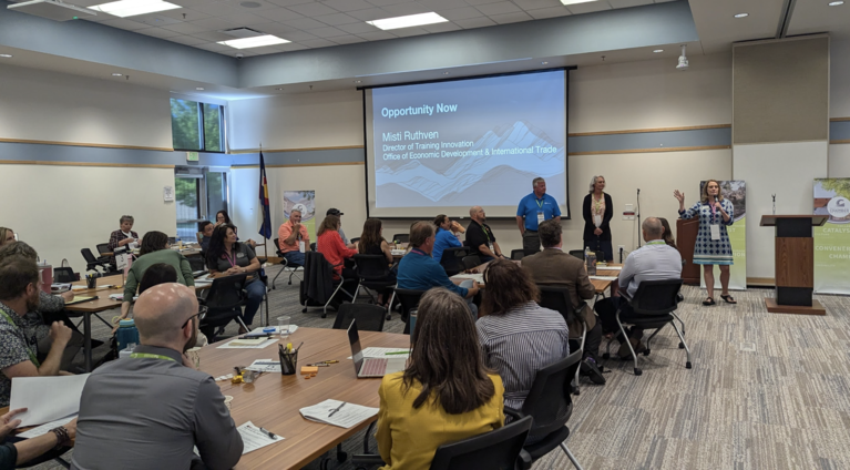 OEDIT Director of Talent Innovation Misti Ruthven speaking to key regional leaders at the Western Region Opportunity Now Summit.