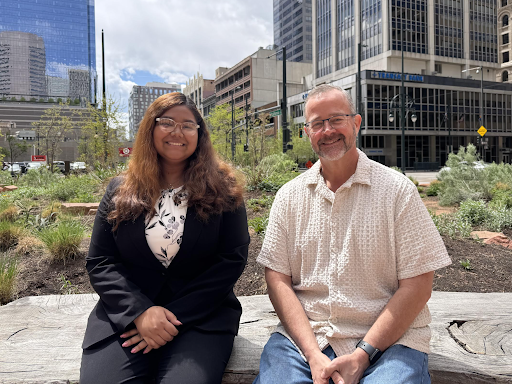 Thomas and Zarin sitting in courtyard